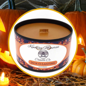 Jack-o'-lantern candle with carved pumpkins.
