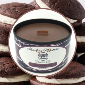 Whoopie pie candle with chocolate treats background.