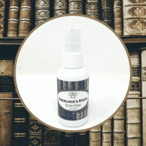 Room spray bottle in front of books.