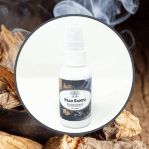 Palo Santo room spray with wooden background.
