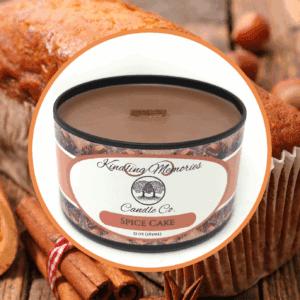 Spice cake candle with baked goods background.