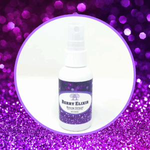 Berry Elixir room spray on purple background.