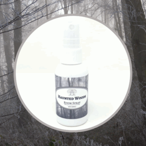 Room spray bottle labeled "Haunted Woods".