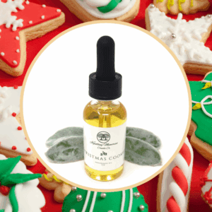 Aromatherapy oil surrounded by decorated cookies.